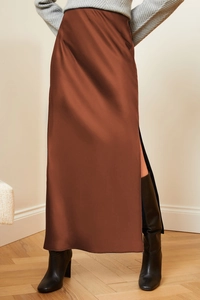Elegant high-waist satin skirt in deep brown featuring a side slit and silky texture