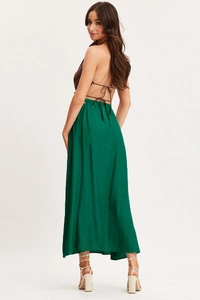 Detail of high waist green maxi skirt featuring side hollow out and elastic waistband