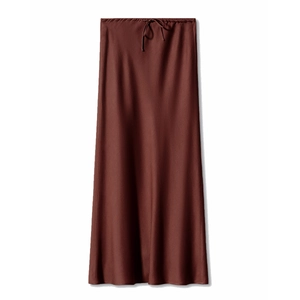 Detail of high waisted satin skirt showing drawstring waist and rust red fabric texture