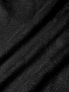 Close-up of premium black faux suede fabric texture and soft fiber details on a skirt