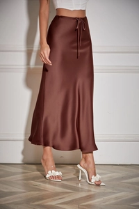 Detail of dark brown satin maxi skirt showing glossy fabric texture and drawstring waist