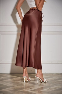 Detail view of coffee brown satin midi skirt showing smooth texture and side drawstring