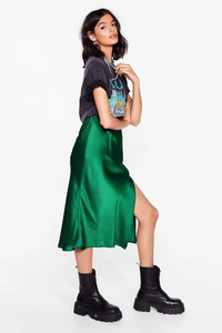 Emerald green satin midi skirt with elegant side slit and smooth glossy silk texture