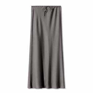 Detail of dark grey satin maxi skirt featuring an adjustable drawstring elastic waistband