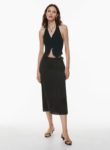 Detail of high waist satin midi skirt with a side slit and elegant flowing fabric texture