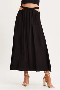 Close-up of high-waist elastic band with side cutout detail on the long black skirt