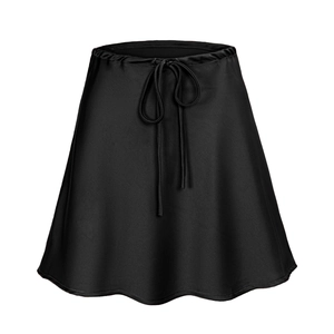 Detail of black satin skirt with drawstring waist showing silky fabric texture