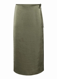 Detailed view of dark olive green satin maxi skirt with side slit and waist tie detail