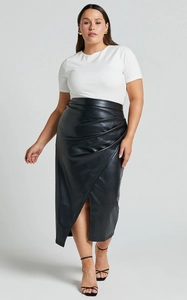 Detail view of the high-waisted PU leather skirt featuring ruching and a stylish side slit
