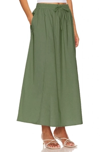Detail of army green cotton maxi skirt featuring elastic drawstring waist and side pockets