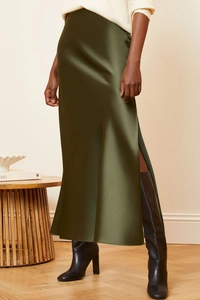 Detail view of smooth olive green satin midi skirt featuring a side slit and glossy finish