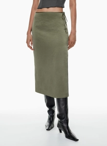 Detail of olive green satin skirt showing waist tie knot and silky fabric texture