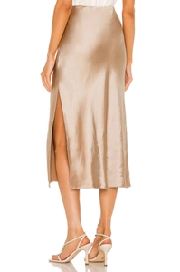 Detailed side view of high-quality champagne satin midi skirt showing a sexy side slit detail