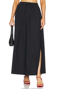 Detail of high waisted cotton maxi skirt with elastic waistband and adjustable drawstring