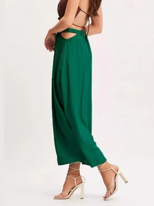 Elegant emerald green high-waisted maxi skirt with side cut-out and elastic waist detail