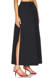 Detail of high waisted cotton skirt featuring adjustable drawstring and side slit design