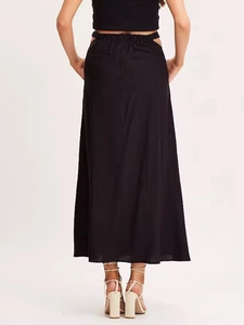 Women's black high-waist maxi skirt with side cut-out details and elastic waist