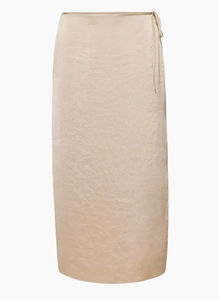 Detail of satin high-waisted midi skirt with side-tie waist and smooth champagne fabric