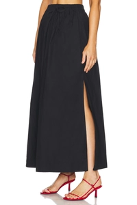 Detail showing high waist elastic drawstring and side slit on this black maxi skirt