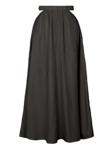High-waisted black maxi skirt with elastic waist and unique side cut-out details