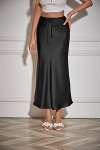 Detail of high waist drawstring on a black satin midi skirt with glossy silk-like finish