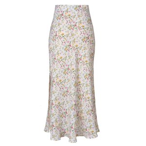 Detail of high-waist acetate satin skirt with side slit and floral patterns