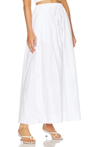 Detail of high waist cotton skirt with drawstring waist and natural textured fabric