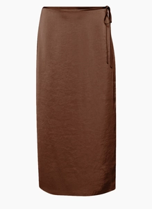 Detail of a dark coffee brown wrap skirt featuring a high waist tie-up and natural texture