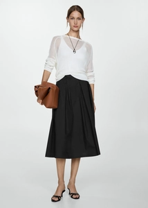 Stylishly paired high waisted pleated midi skirt with white mesh top and accessories