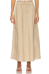 Detail of high waist beige cotton maxi skirt with elastic drawstring and side pockets