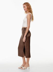 Detail view of high waist satin maxi skirt with elegant side slit and tie waist belt