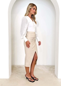 Close-up of beige high waisted wrap midi skirt with side slit and gathered details