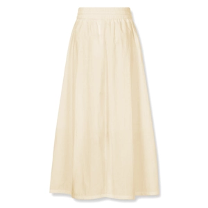 Detailed view of elastic high waist and pocket stitching on beige cotton long skirt