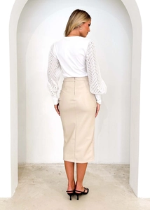 Detail view of high waisted beige PU leather midi skirt with back zipper and seam details