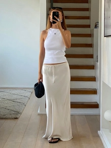 Elegant white halter top and ivory high-waist satin maxi skirt set for women