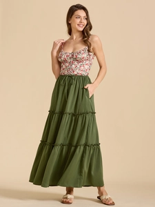 Close-up of high-waisted dark green tiered maxi skirt with adjustable drawstring detail