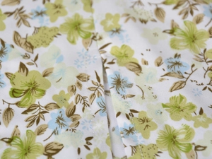 Close-up detail showing the fine stitching and floral satin fabric of the high waist skirt