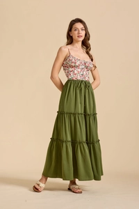 Detail of high waist olive green tiered maxi skirt with drawstring and floral tank top