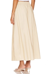 Detail of high waisted cotton maxi skirt showing elastic waist and pleated A-line silhouette