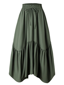 Detail of high waist elastic waistband with adjustable drawstring on dark green maxi skirt