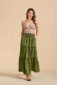 Detail of floral spaghetti strap bodice with drawstring waist and tiered olive green skirt