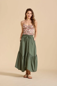 Detailed view of high-waist maxi skirt featuring adjustable tie waist and tiered ruffle hem
