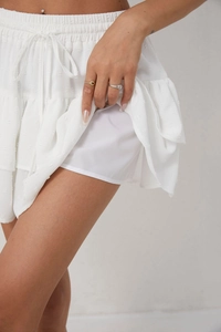 Detail view of white chiffon sports skirt featuring built-in anti-exposure safety lining
