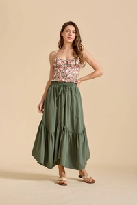 Detail of high waisted tiered maxi skirt with adjustable drawstring and floral crop top