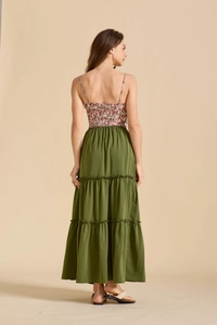 Back view of a tiered maxi dress featuring a red floral bodice and olive green skirt