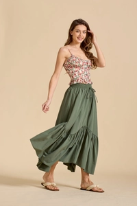 Detail of high waist olive green maxi skirt with adjustable drawstring and wavy hem