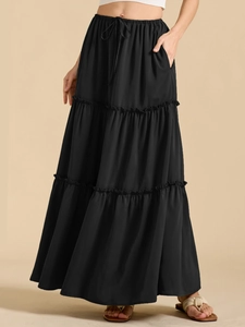 Detail of high waisted tiered black maxi skirt with adjustable drawstring waist tie