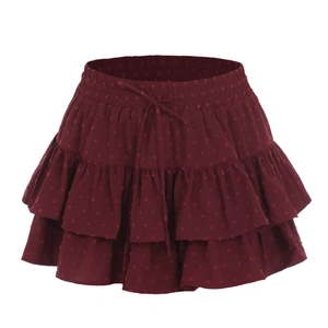 Close-up of wine red tiered mini skirt featuring Swiss dot fabric and drawstring elastic waist
