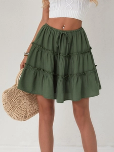 Detailed view of olive green tiered mini skirt with elastic drawstring high waist