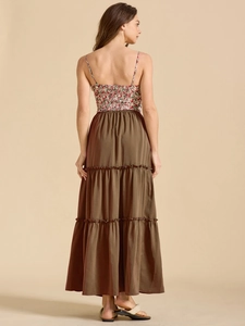 Detailed back view of a tiered dress with floral shirred bodice and olive green skirt